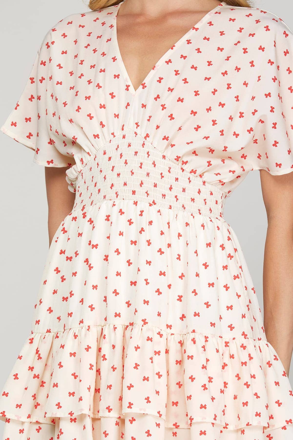 MINI BOW PRINT WAIST SMOCKING MINI DRESS