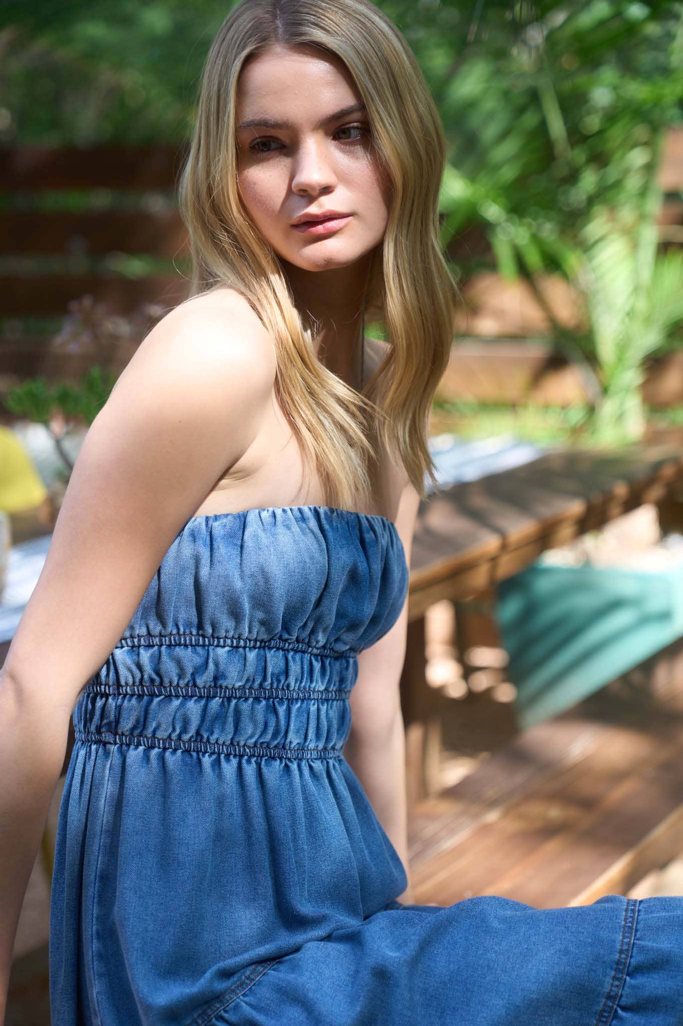 STRAPLESS SHIRRED TIERED DENIM MIDI DRESS
